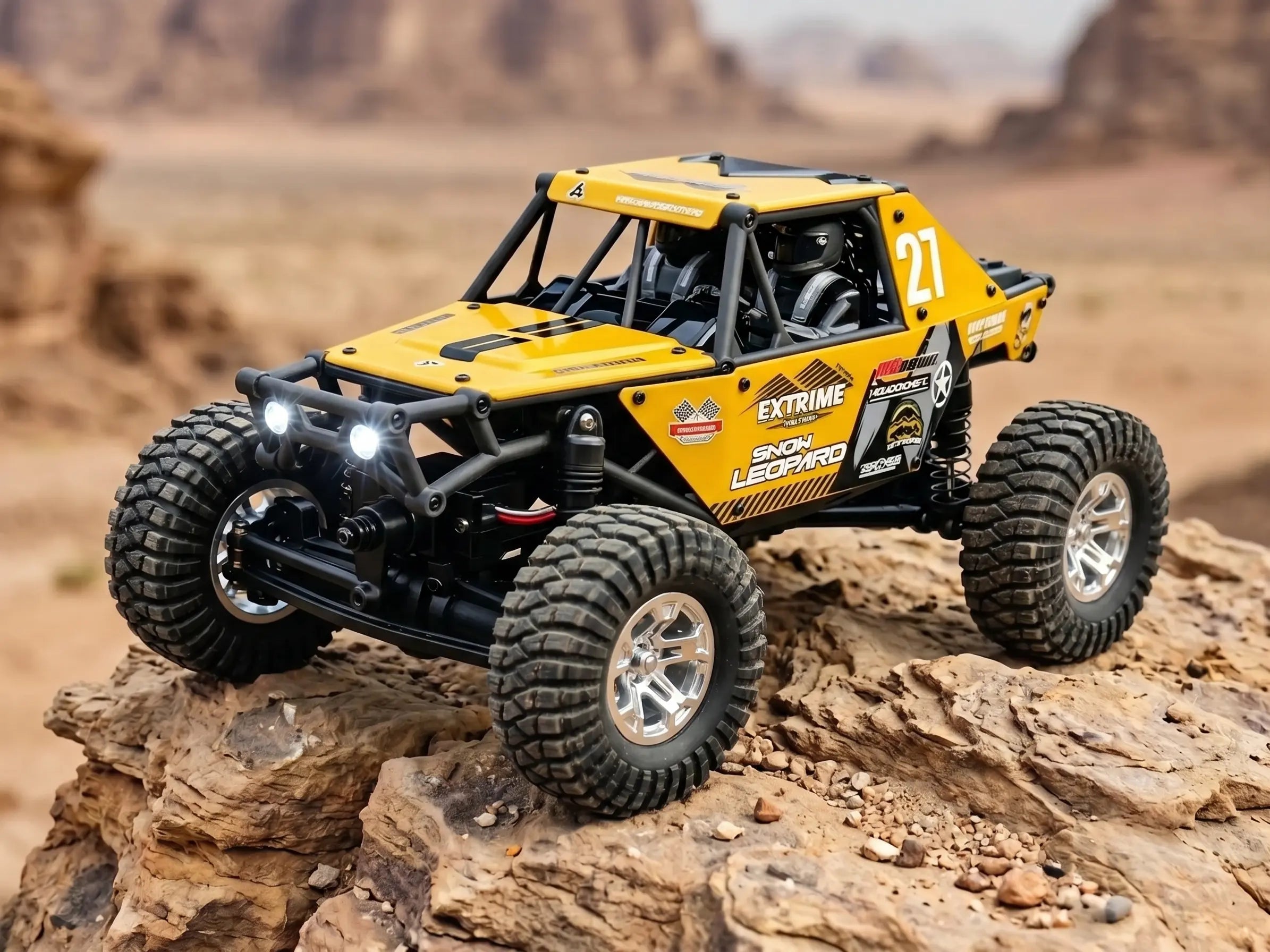 Detailed yellow micro RC desert buggy on a rock in the desert, headlights on.